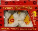Furry cuffs, colour white, in colour box